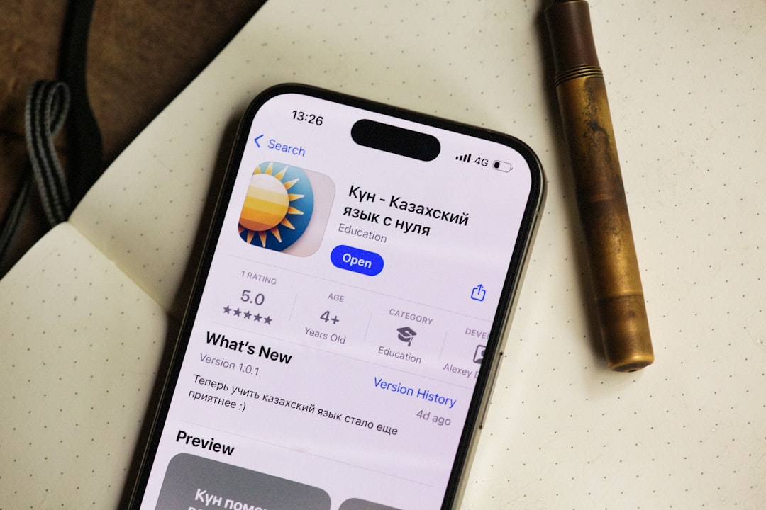 An iPhone shows a kazakh language learning app.