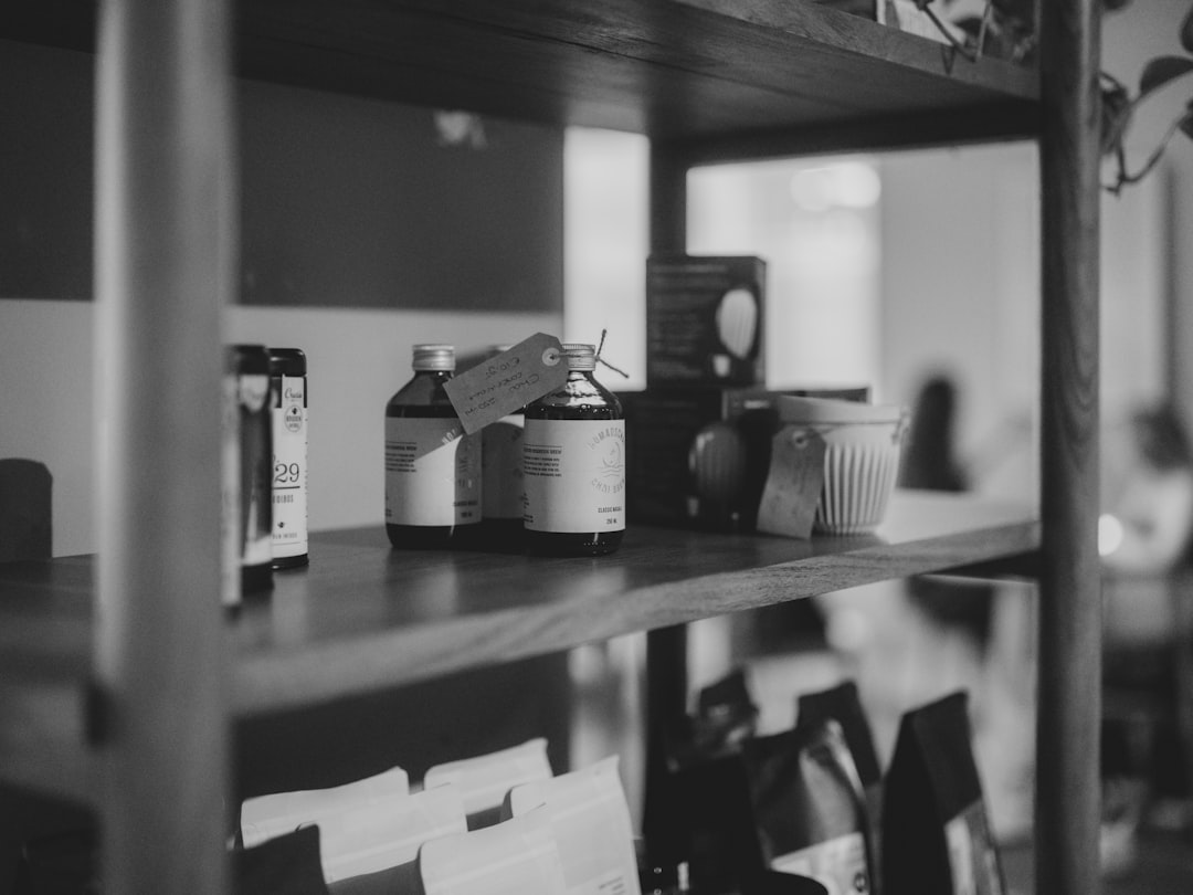 Bottles and items on a wooden shelf