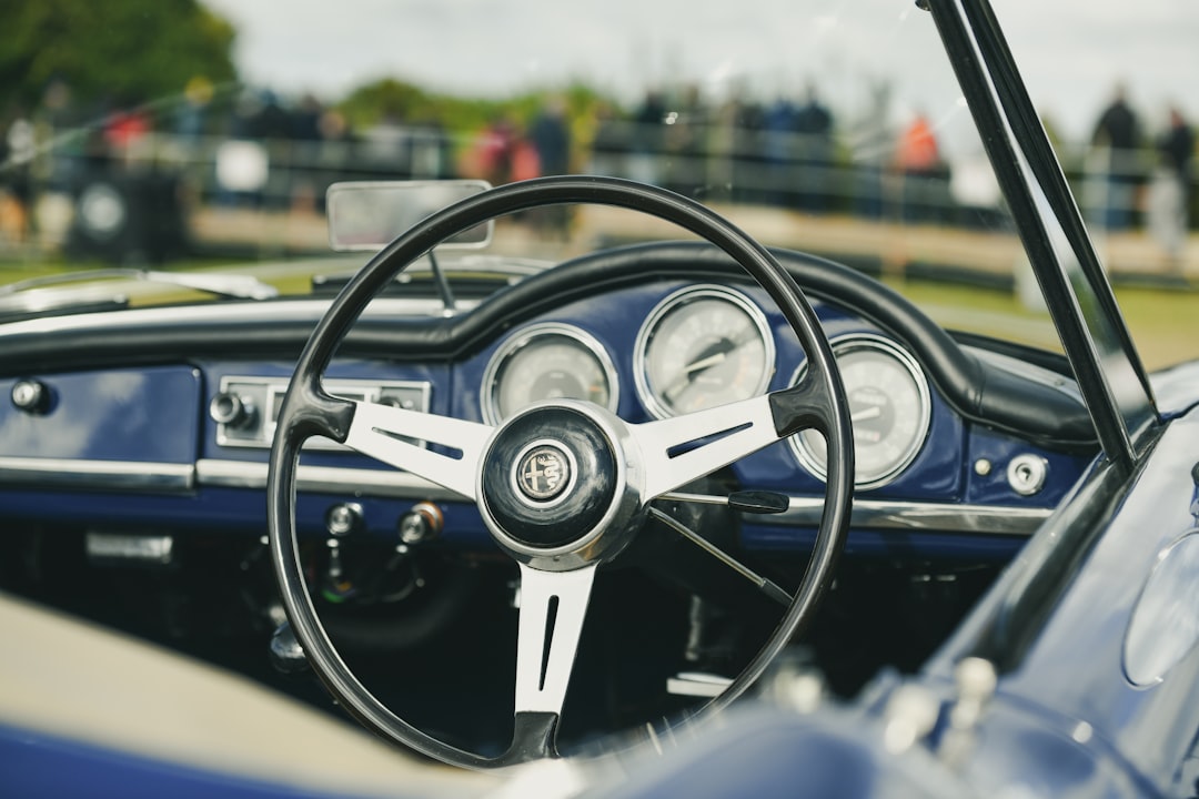 Vintage car dashboard with steering wheel and gauges