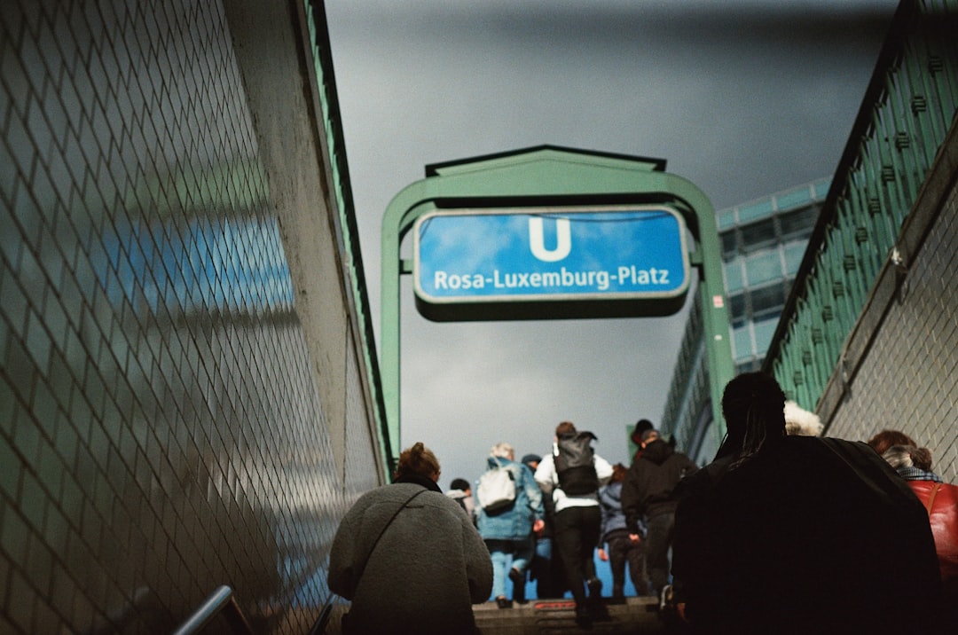 People walk up stairs at rosa-luxemburg-platz u-bahn station