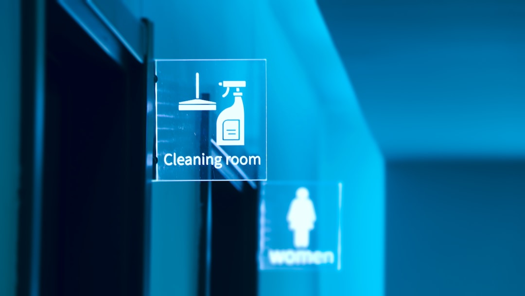 a glass door with a cleaning room sign on it