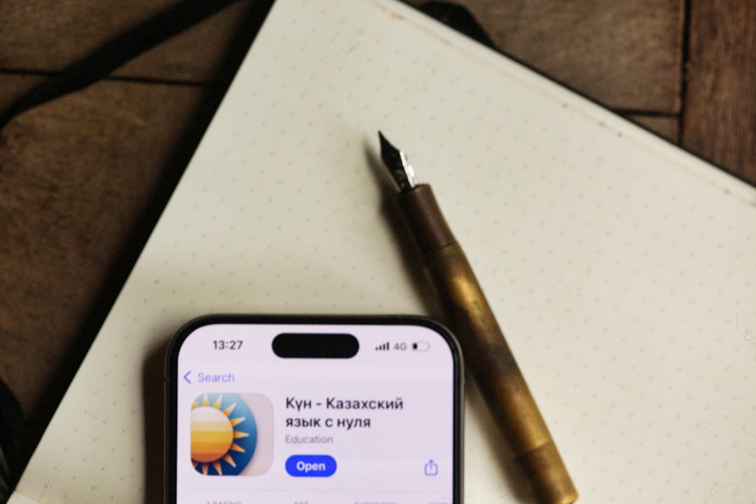 Phone, pen, and notebook displayed together.